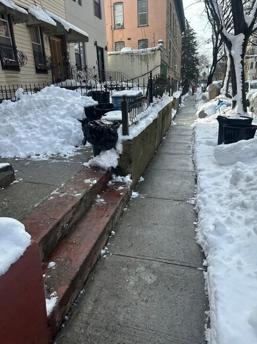 Sidewalk cleared of snow